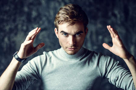 A man with a serious look staring at the camera. The power of thought, brainstorming. Business concept.の写真素材