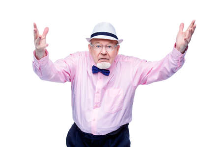 Angry old man expresses his dissatisfaction. Social protection, rights of pensioners. Isolated over white. Copy space.の写真素材