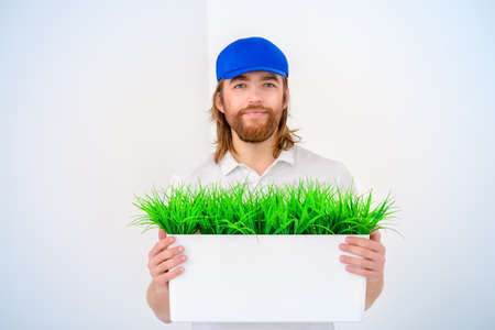 Positive young man in casual clothes. White background.の写真素材