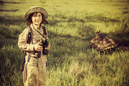 Boy exploring nature and the world around us. Adventure trips. The young scout.の写真素材