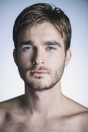 Portrait of a brutal handsome man with naked torso. Male beauty, health.の写真素材