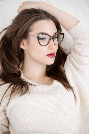 Beautiful sexy woman at home. Beauty, fashion. Optics style.の写真素材