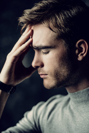 Portrait of a handsome man is thinking hard about something. The power of thought, brainstorming....