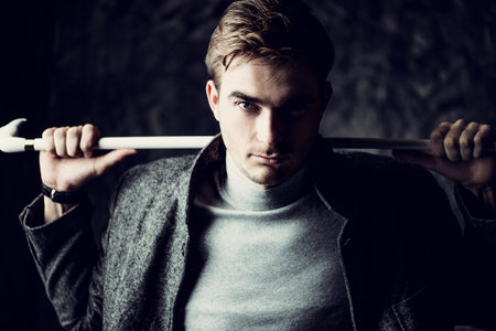 Male beauty, fashion. Portrait of a handsome man wearing coat. Seasonal clothes collection.