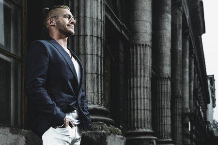 Portrait of a businessman the city. Lively active lifestyle. Success. Male beauty, fashion.