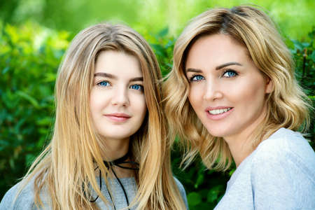 Happy mother with her teen daughter on a summer day.  Beauty, cosmetics.の写真素材
