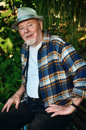 Portrait of a handsome senior man having a rest on a sunny summer day. Healthcare, resort. Happy...