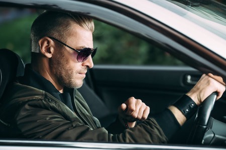 Mature man driving a car. Vehicle concept.