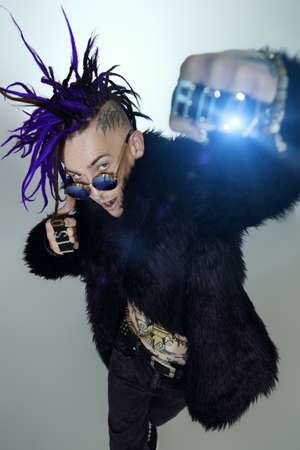 Portrait of a punk rock musician posing at studio. Youth alternative culture.の写真素材