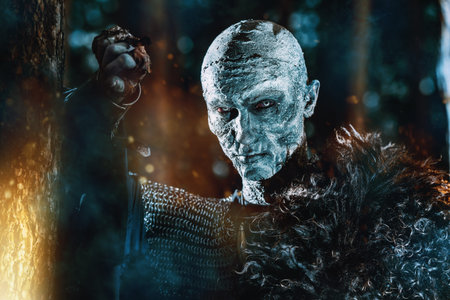 Zombie warrior in knightly armor stands in the night forest. Fantasy horror film. Halloween.