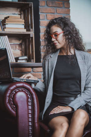 Businesswoman is working on a laptop at the office.の写真素材