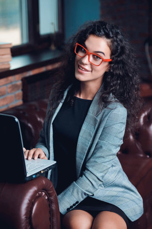 Businesswoman is working on a laptop at the office.