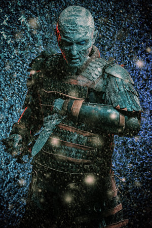 Halloween. Frozen snow covered zombie warrior in the armor of a medieval knight.