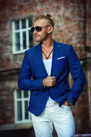 Handsome mature man in stylish suit in the old town. Male beauty, fashion.の写真素材