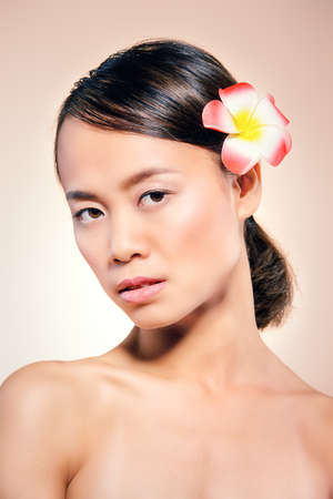 Beauty portrait of a tender asian woman with perfect skin. Healthcare, body care and cosmetics.の写真素材