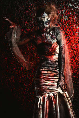 Portrait of a bloody dead bride woman. Zombie bride. Halloween. Horror.の写真素材