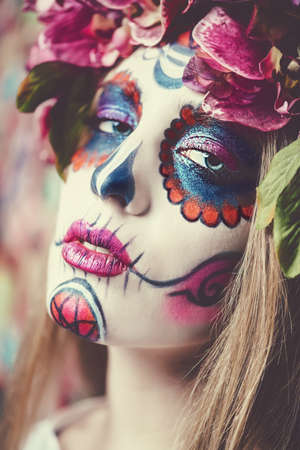 Closeup portrait of Calavera Catrina. Young woman with sugar skull makeup. Dia de los muertos. Day of The Dead. Halloween.の写真素材