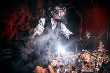 Scientist inventor steampunk works in his laboratory. Science fiction concept. Halloween.