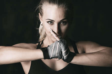 Portrait of a beautiful athletic woman with perfect muscular body. Active, healthy lifestyle. Fitness, bodybuilding.の写真素材