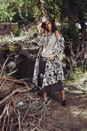 Beautiful sexy fashion woman posing outdoor. Fashionable clothes.