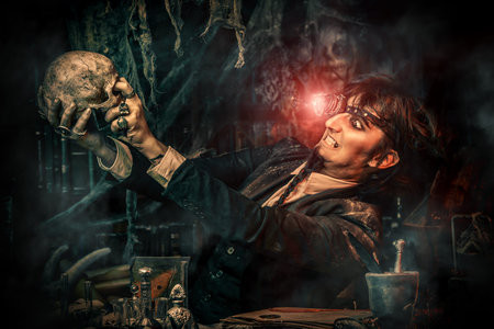 Portrait of a medieval scientist working in his laboratory. Alchemist. Halloween.