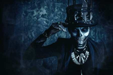 Close-up portrait of a man with a skull makeup dressed in a tail-coat and a top-hat. Baron Saturday....