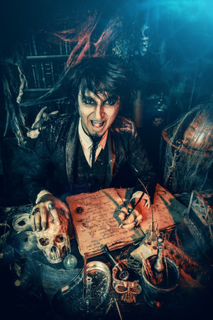 Portrait of a medieval scientist working in his laboratory. Alchemist. Halloween.