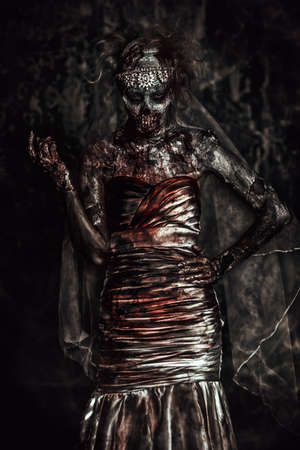 Portrait of a bloody dead bride woman. Zombie bride. Halloween. Horror.の写真素材