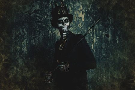 A man with a skull makeup dressed in a tail-coat and a top-hat. Baron Saturday. Baron Samedi. Dia de los muertos. Day of The Dead. Halloween.の写真素材