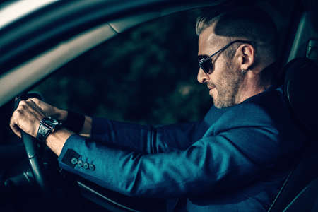 Mature man driving a car. Vehicle concept.の写真素材