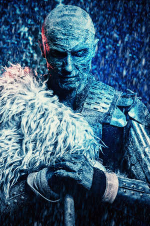 Halloween. Frozen snow covered zombie warrior in the armor of a medieval knight.の写真素材