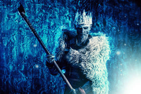Halloween. The King zombie warrior in the armor of a medieval knight covered with snow. Horror fantasy film.の写真素材