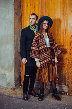 Beautiful stylish young people in autumn clothes posing in the old town. Autumn fashion. の写真素材