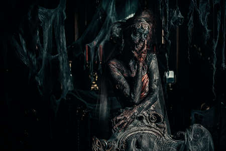 Zombie bride. Bloody dead bride woman in the old abandoned castle. Halloween. Horror.の写真素材