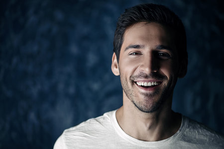 Happy young man looking at camera and smiling. Men's beauty and health.の写真素材