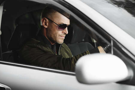 Mature man driving a car. Vehicle concept. の写真素材