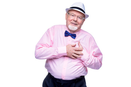 Handsome old man wearing elegant clothes and bow-tie. Isolated over white.