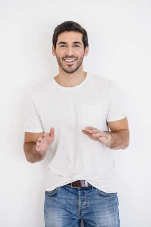 Happy young man looking at camera and smiling. Men's beauty and health.の写真素材