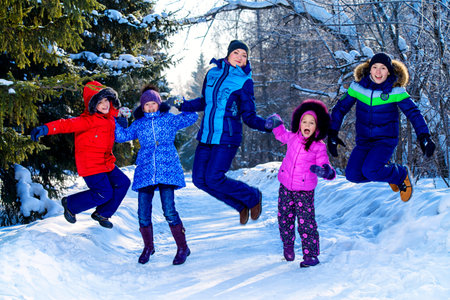 Happy family enjoy sunny winter day. Snow. Winter clothes. Winter activity.の写真素材