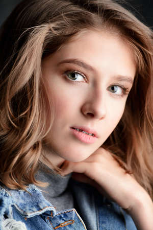 Cute girl teenager wearing dental braces. Healthcare, stomatology and orthodontics.の写真素材