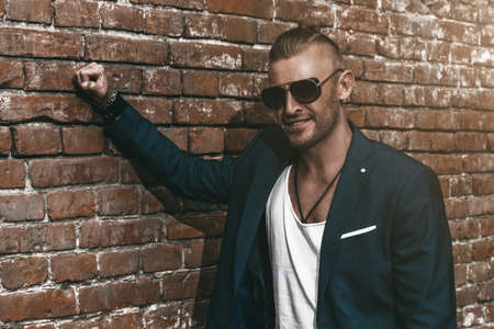 Handsome mature man in stylish suit in the old town. Male beauty, fashion.の写真素材