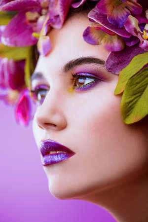 Sensual spring lady in a wreath of flowers. Inspiration of spring and summer. Perfume, cosmetics concept.の写真素材