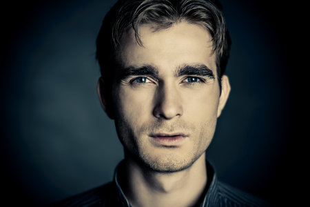 Close-up portrait of a handsome young man. Male beauty. Men's health.
