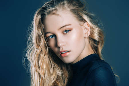 Portrait of a beautiful young woman with blonde long hair. Beauty, fashion concept. Cosmetics and make-up.の写真素材