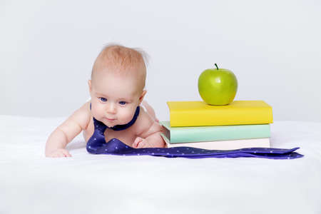Portrait of a baby dressed in a tie. Education and early development concept.の写真素材