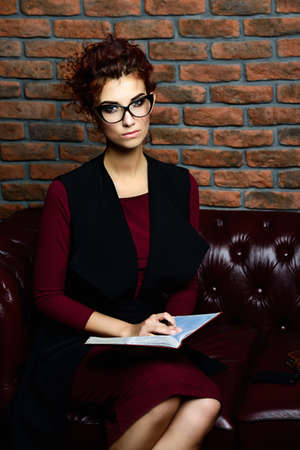 Portrait of a contemporary business woman with notebook.の写真素材