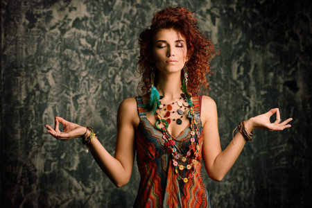 Beautiful bright woman with curly foxy hair wears a beads and earrings in boho style. Ethnic style...