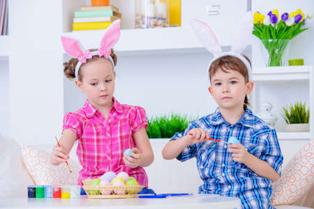 Easter kids. Two happy funny children preparing for the celebration of Easter.の写真素材