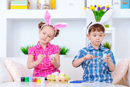 Easter kids. Two happy funny children preparing for the celebration of Easter.の写真素材