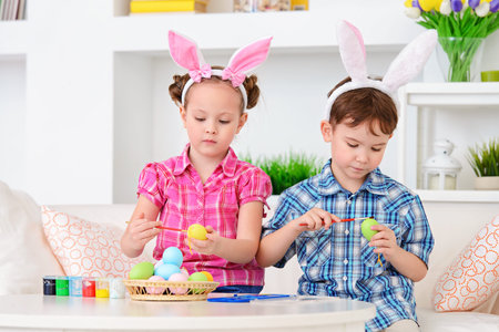 Easter kids. Two happy funny children preparing for the celebration of Easter.の写真素材